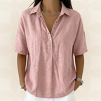 Side profile of a green short-sleeved shirt, highlighting its comfortable, relaxed fit and drape.