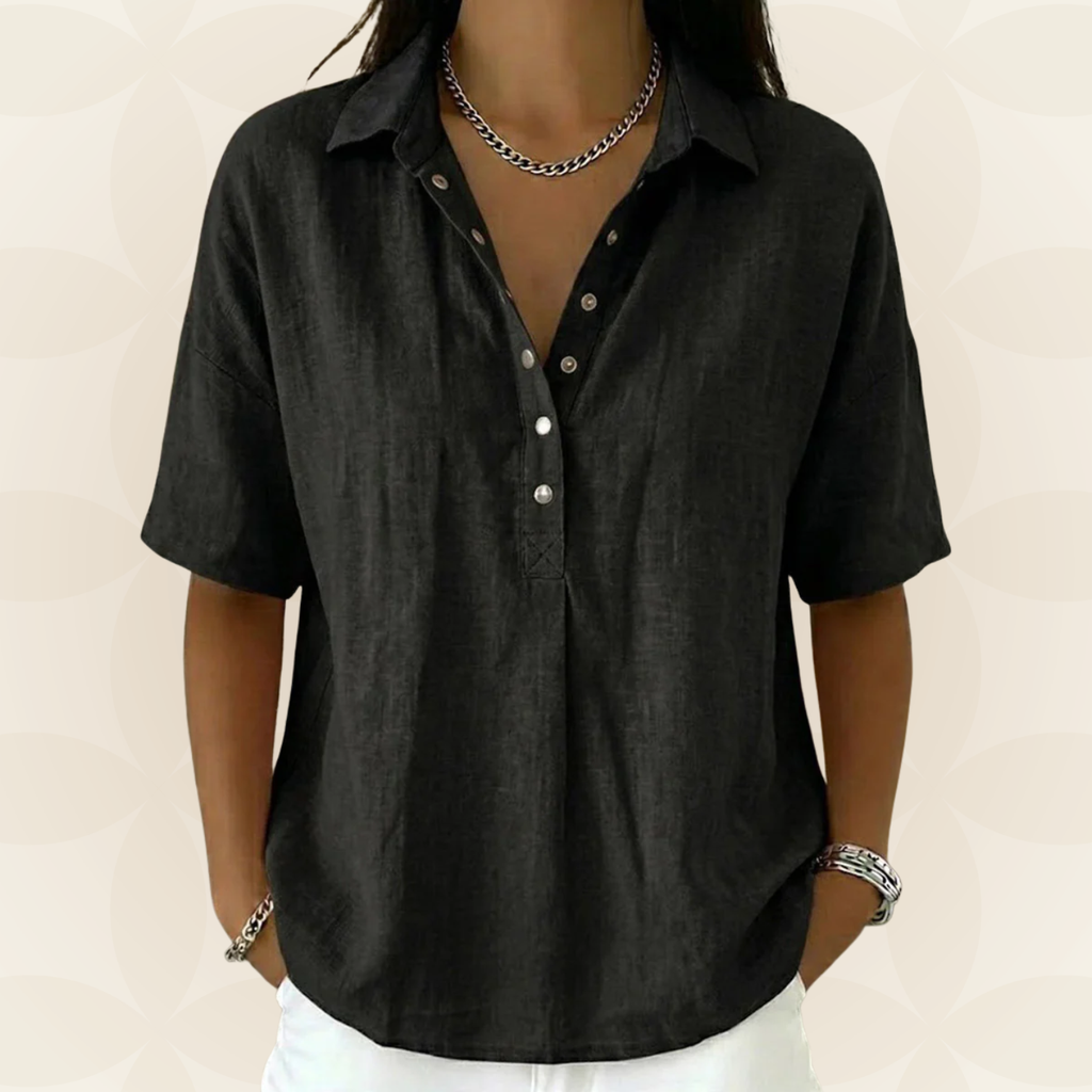 Woman enjoying a sunny day in a black V-neck shirt, looking effortlessly stylish and at ease.
