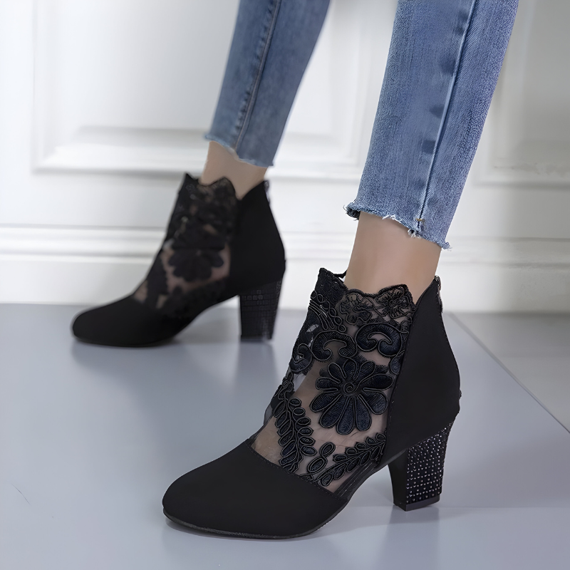 Side profile of a red pair of comfortable orthopedic heels, emphasizing the arch support and cushioned sole.