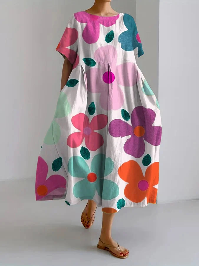 Close-up detail of the vibrant floral print on a breathable summer dress, showcasing the fabric texture and colors.