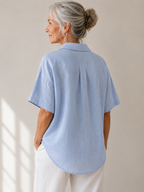 Full length view of a white short-sleeved shirt, perfect for a relaxed yet polished ensemble.