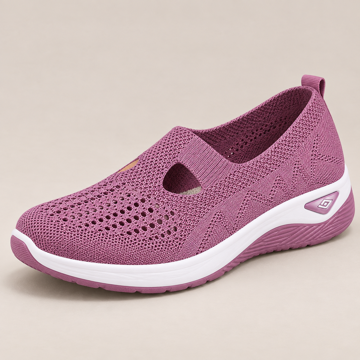 Rear view of the sturdy heel support on a pair of grey sneakers, providing stability details.