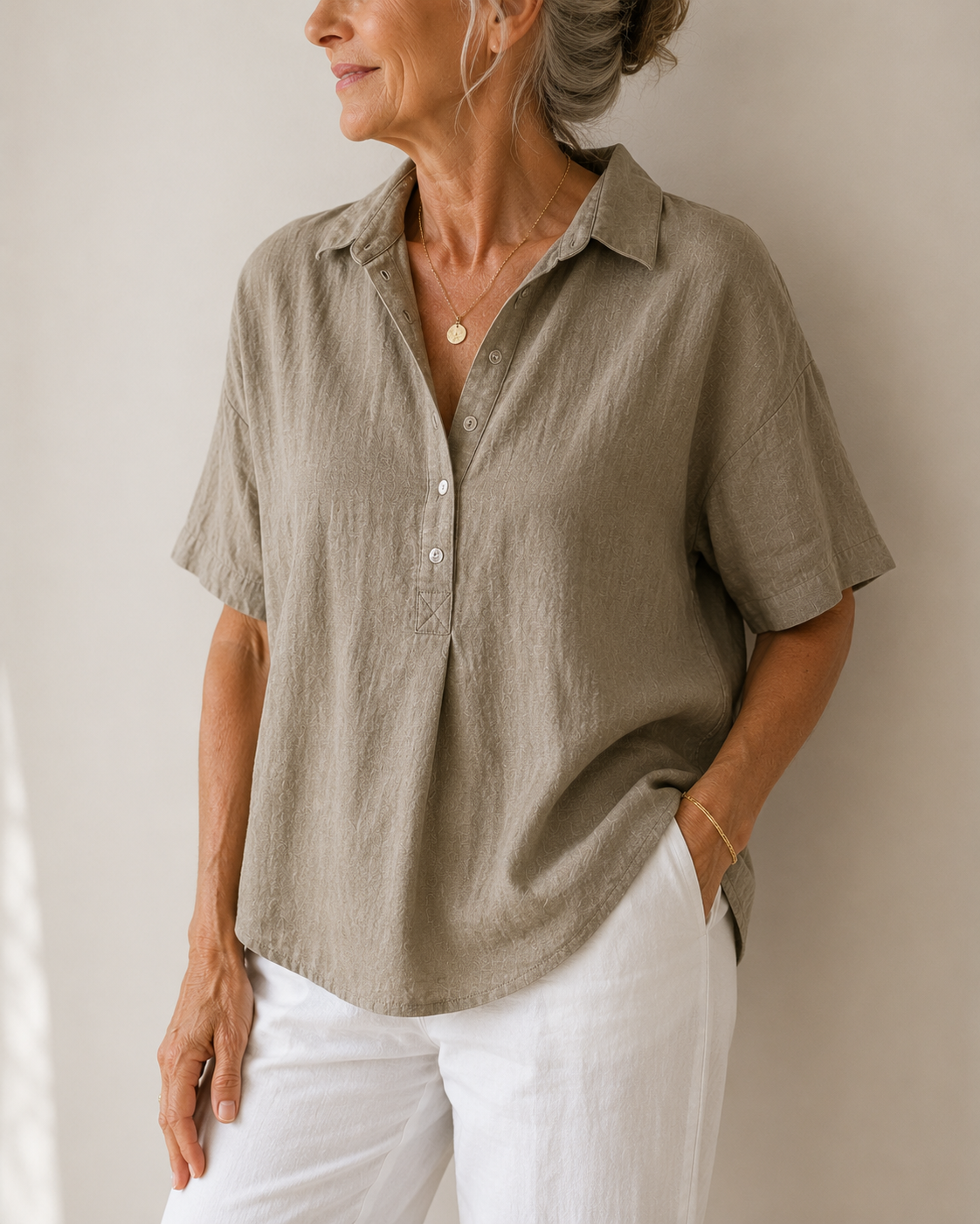 Detailed shot of the soft texture and subtle weave of the airy cotton blend shirt fabric.