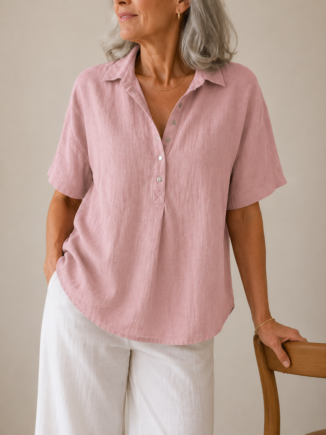 A light blue shirt paired with a skirt, illustrating its versatility for various stylish outfits.