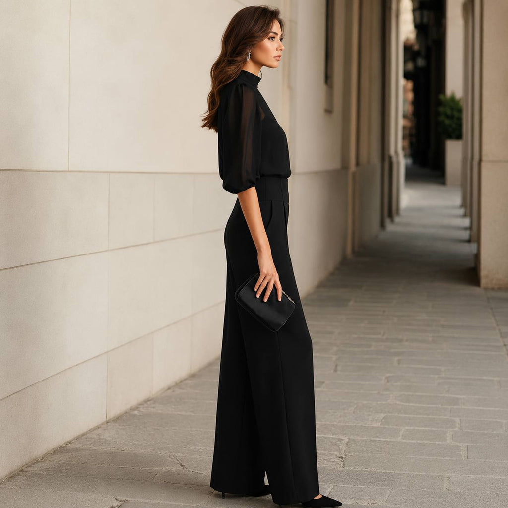 Close-up detail of the delicate sheer sleeves and the soft chiffon fabric texture of the Lysandra blouse.