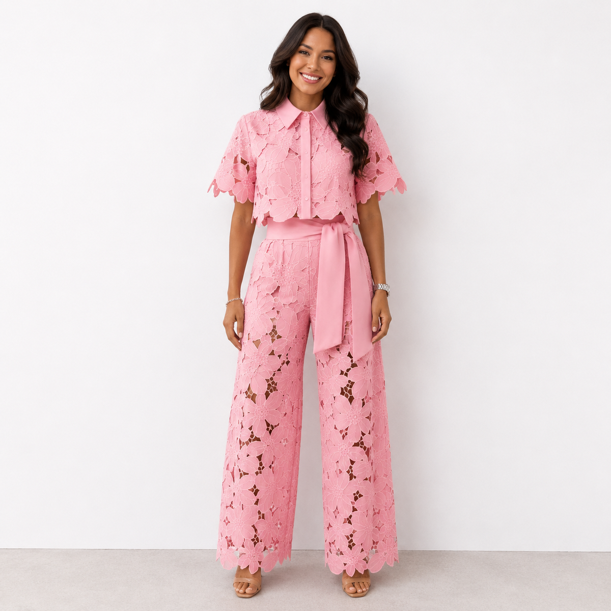 Pink embroidered trousers styled casually, perfect for achieving a chic and comfortable everyday look.