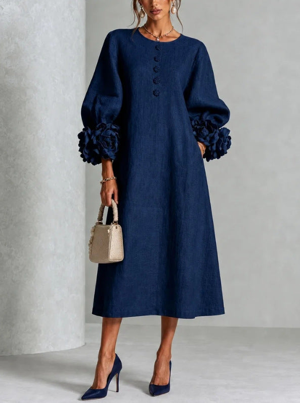 Flat lay of the green Elowen midi button dress, showcasing its full design and elegant simplicity.