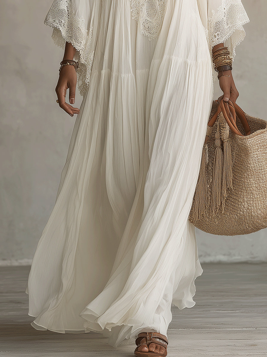Side profile of a woman in the flowy batwing dress, emphasizing the comfortable fit and wide sleeves.