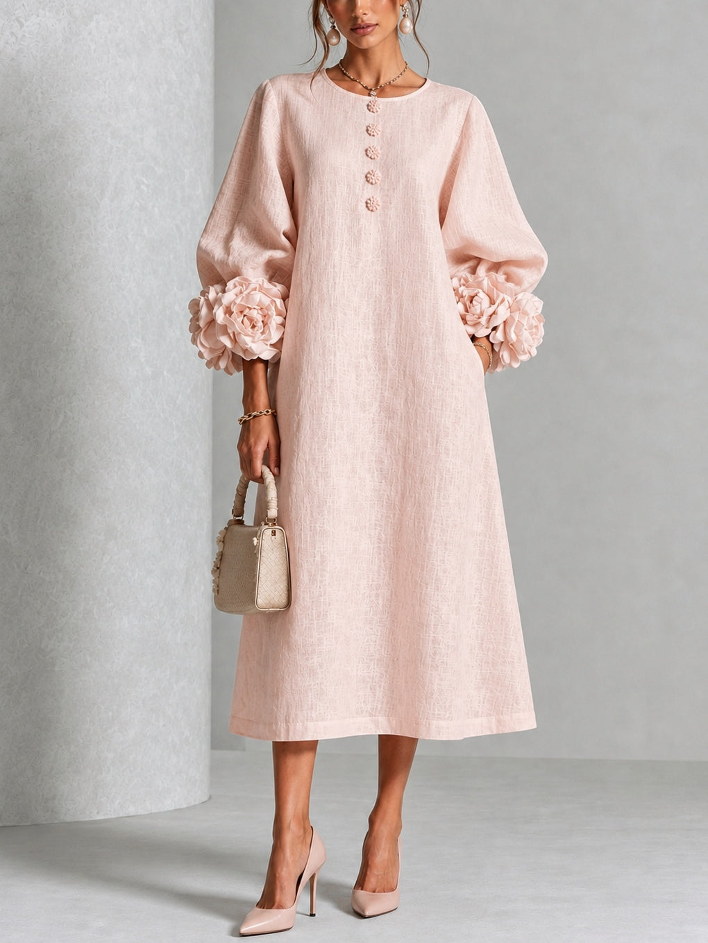 Side profile of the Elowen midi button dress in white, showcasing its relaxed A-line silhouette and flow.