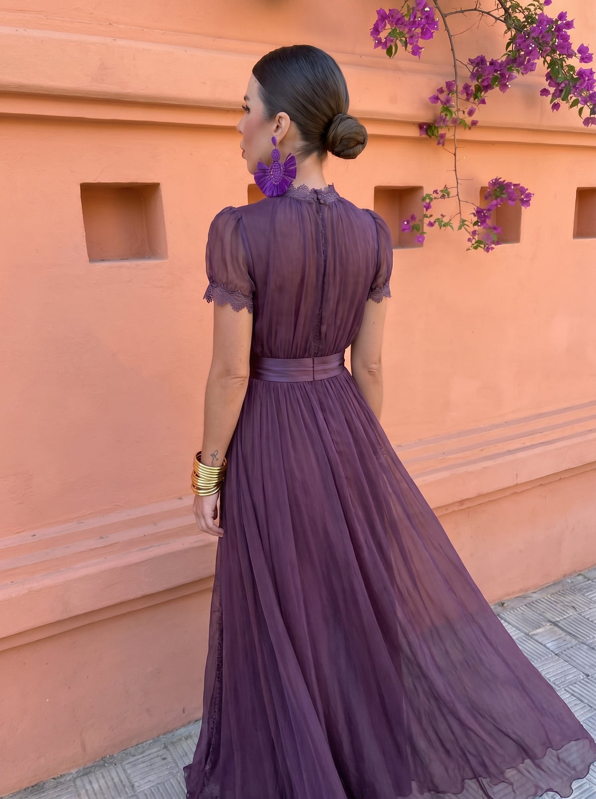 Woman wearing the comfortable chiffon maxi dress, walking outdoors, highlighting its graceful movement.