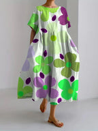 Back view of the elegant floral dress, highlighting the flowy skirt and lightweight feel perfect for warm weather.