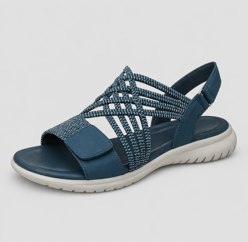 Close-up of the blue walking sandals, highlighting the adjustable strap closure and flexible anti-slip outsole texture.
