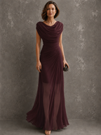 A woman posing confidently in the light pink maxi dress, emphasizing its flattering fit and sophisticated appeal.