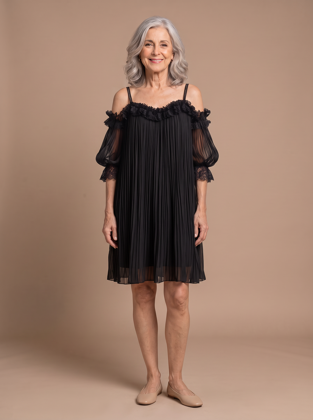 Anya - Elegant Muslin Mini Dress, model draagt de zwarte jurk op warme beige studio-achtergrond