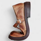 Pair of brown elegant shoes neatly arranged on a wooden floor, ready for a day out or a special occasion.